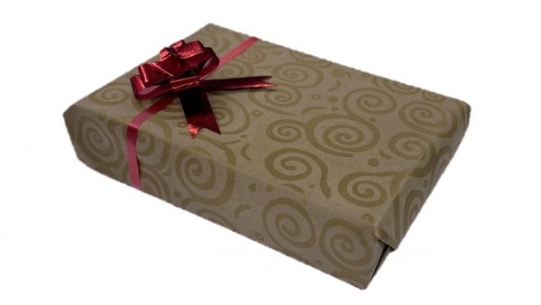 gold spiral patterned gift wrap with red bow